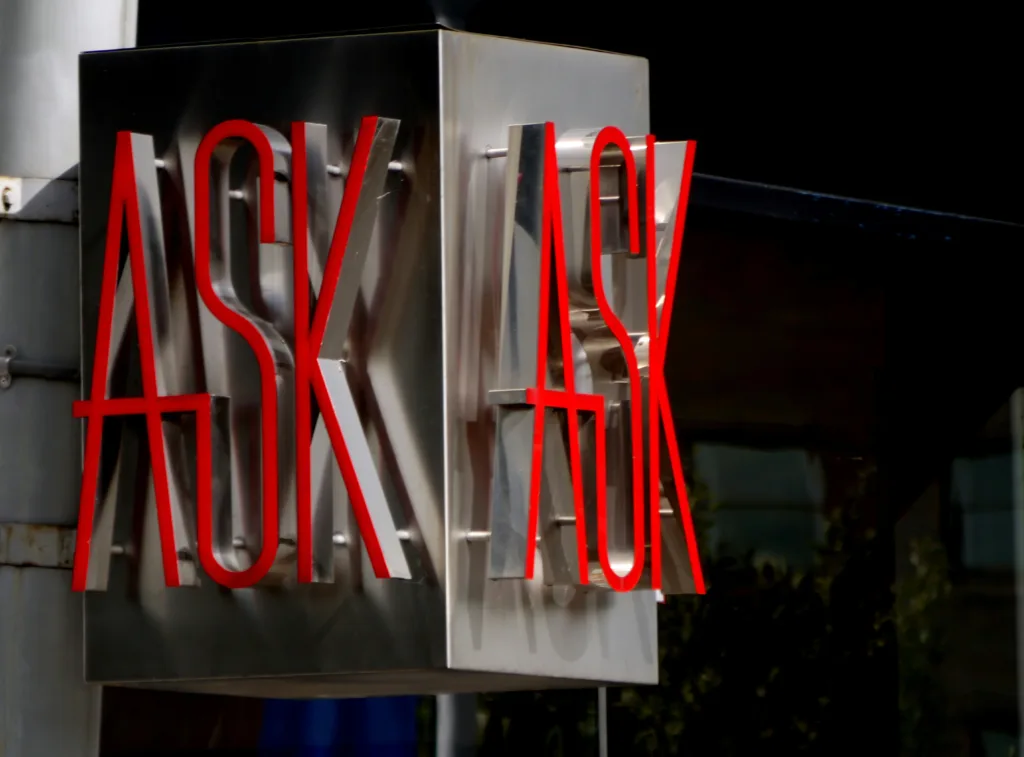 A silver sign with the words 
