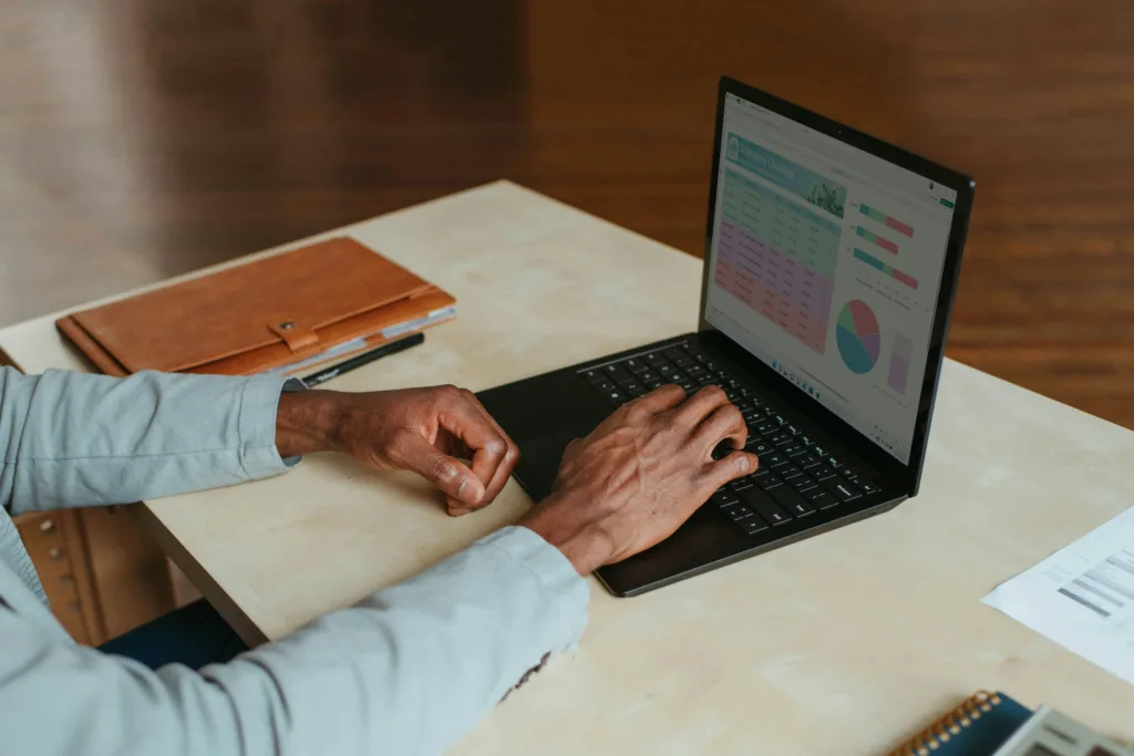 Man working on a laptop showing the best junior developer Jobs For Techies.